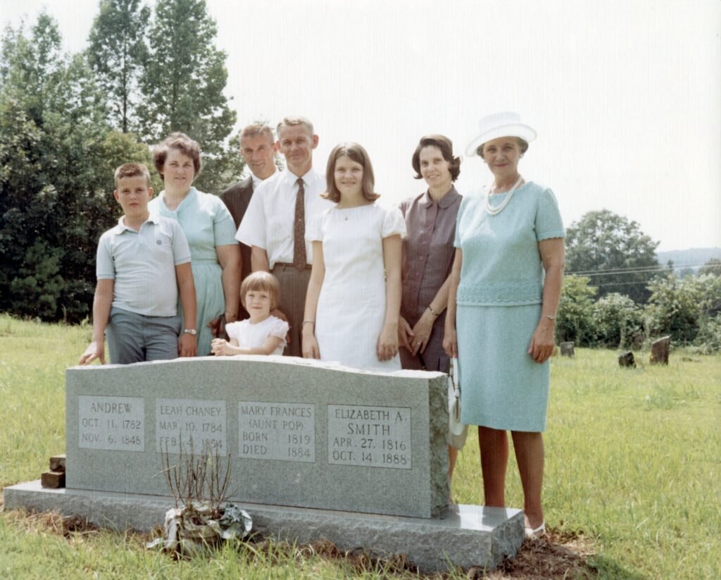 1966 Aldridge reunion in Blount County, made at the grave of our ancestors Andrew Alldredge and Leah (Chaney) Alldredge. (Left to right) Doyne Aldridge, Alma Aldridge, Harold Aldridge, Milton Aldridge, Rosemary Aldridge, Ilva Aldridge, Ola Aldridge Johnson. In front Laura Lynn Aldridge.