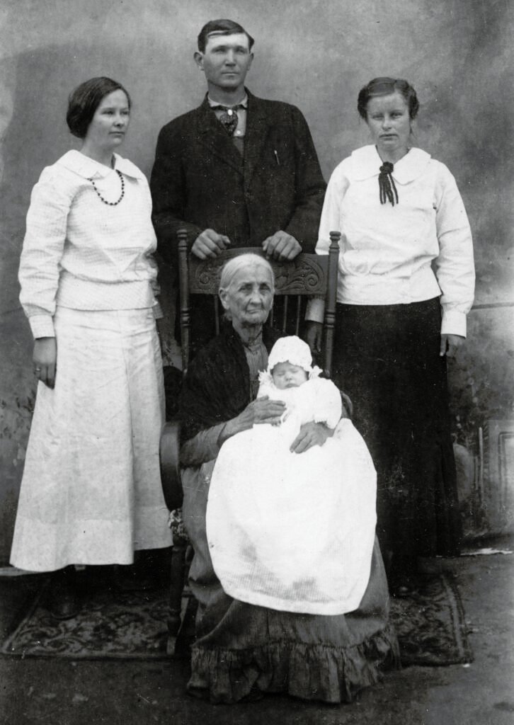 (Left to right) Temperance McCulley (Mabel's sister), Walter Aldridge, Mabel (McCulley) Aldridge, Grandma Nancy (Lewis) McCulley (Mabel's grandmother), holding Ola.