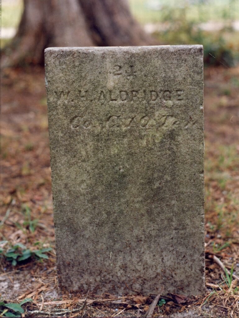 Original permanent marker for W. H. Aldridge at Stonewall Confederate Cemetery. This marker was replaced with a newer one in the twenty-first century, still bearing the incorrect unit.