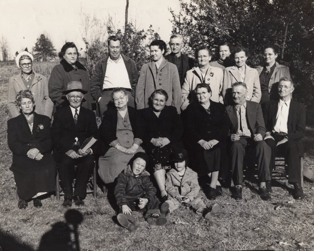Birthday celebration for Rev. W. W. Aldridge, 1954, with children and their spouses and other family.